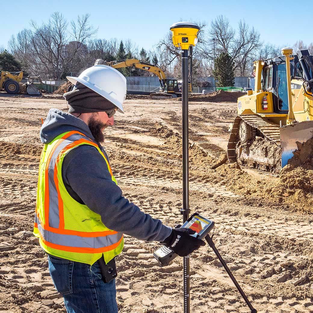 construction surveyor using trimble rover with siteworks